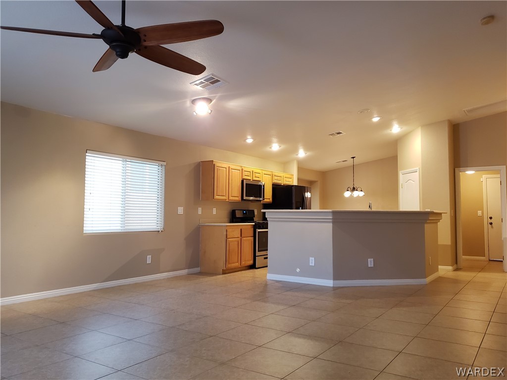 2803 Sunken Ship Street, Unit 89029 Laughlin, NV 89029 - Photo 10 of 35 a view of a kitchen with a sink and a window