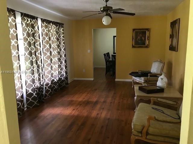 1221 Southwest Stakes Street Arcadia, FL 34266 - Photo 15 of 19 a view of a workspace with furniture and wooden floor
