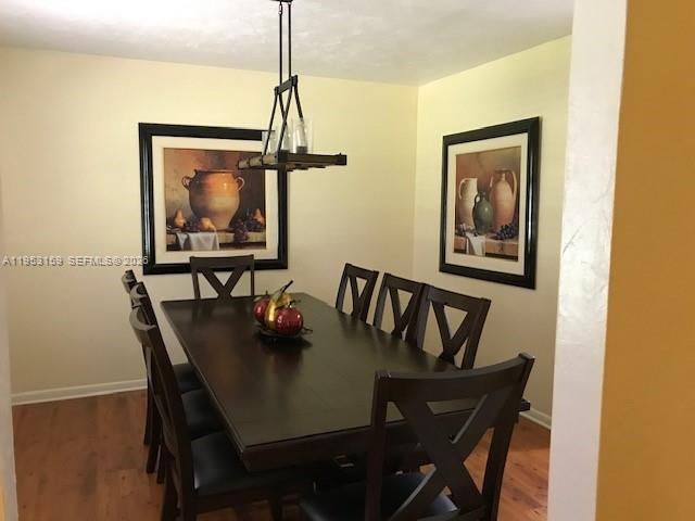1221 Southwest Stakes Street Arcadia, FL 34266 - Photo 16 of 19 a view of a dining room with furniture