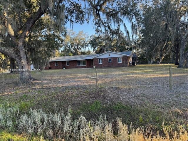 1221 Southwest Stakes Street Arcadia, FL 34266 - Photo 18 of 19 a view of a house with a yard