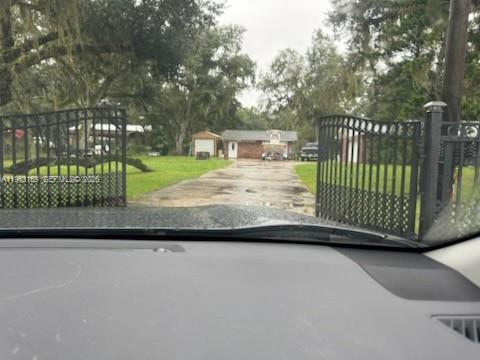1221 Southwest Stakes Street Arcadia, FL 34266 - Photo 3 of 19 a view of a house with a small yard and wooden fence