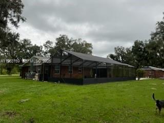 1221 Southwest Stakes Street Arcadia, FL 34266 - Photo 7 of 19 a view of a house with a yard and sitting area