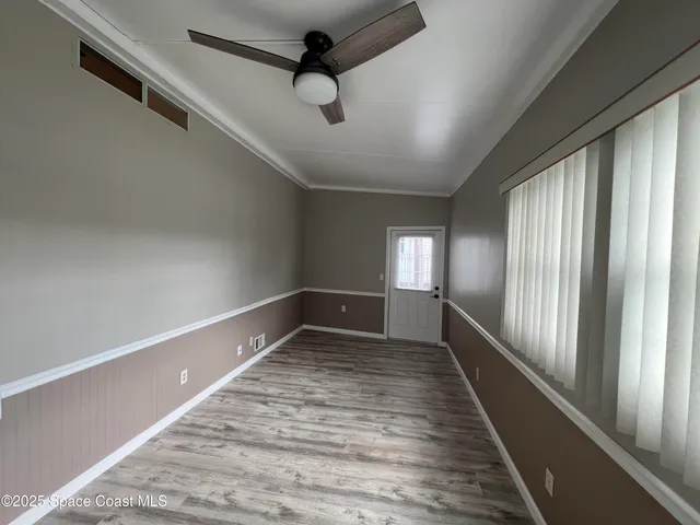 a kitchen with granite countertop a sink cabinets and stainless steel appliances