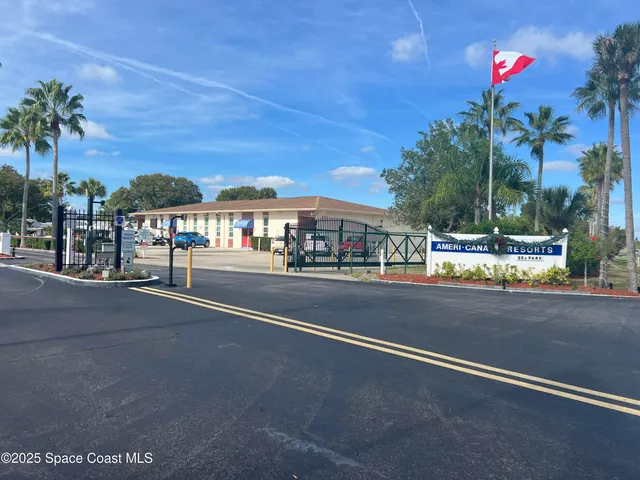 a view of a swimming pool with a patio and a garden