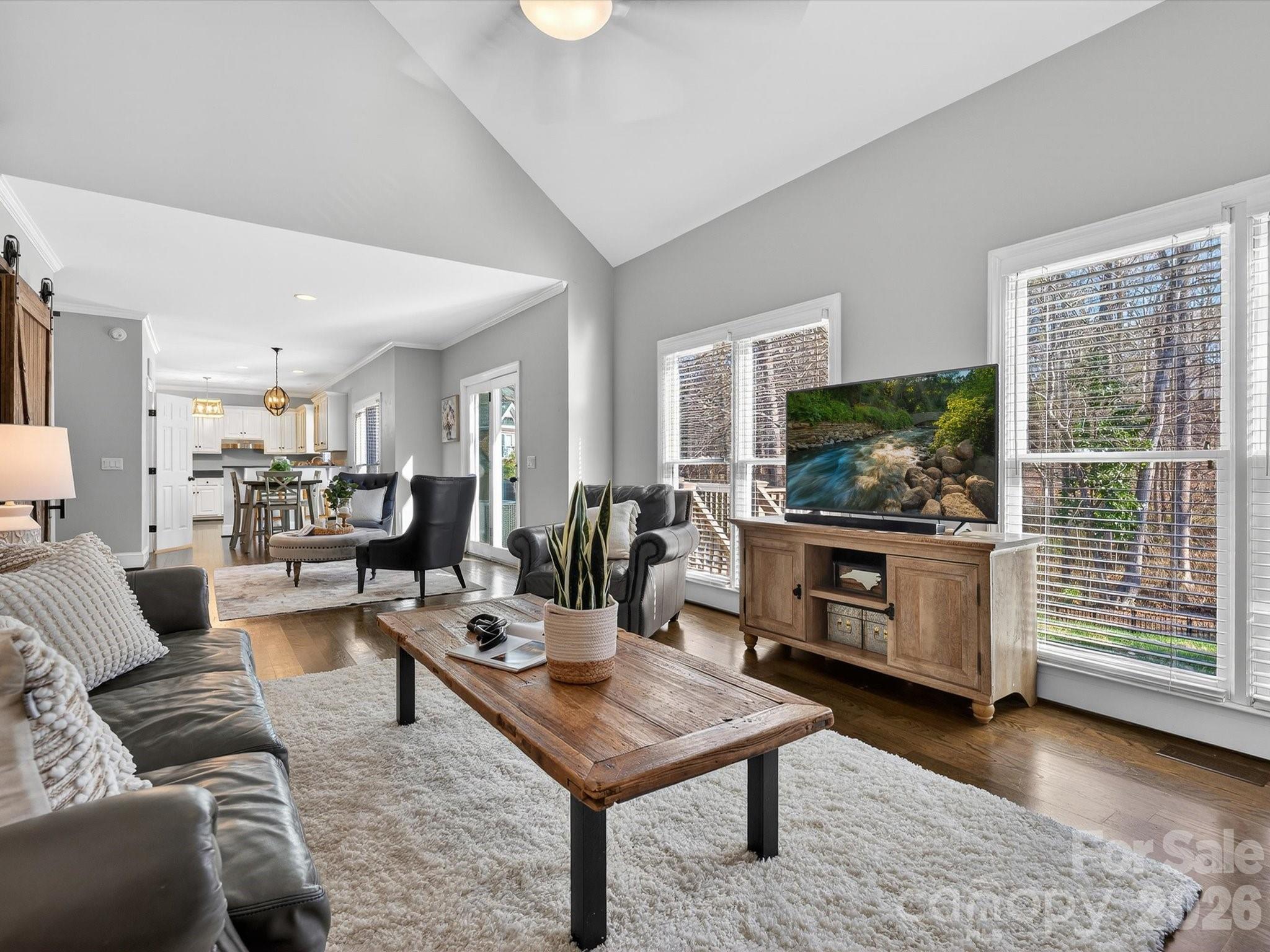 13446 Scanlan Way Davidson, NC 28036 - Photo 13 of 47 a living room with furniture and a flat screen tv