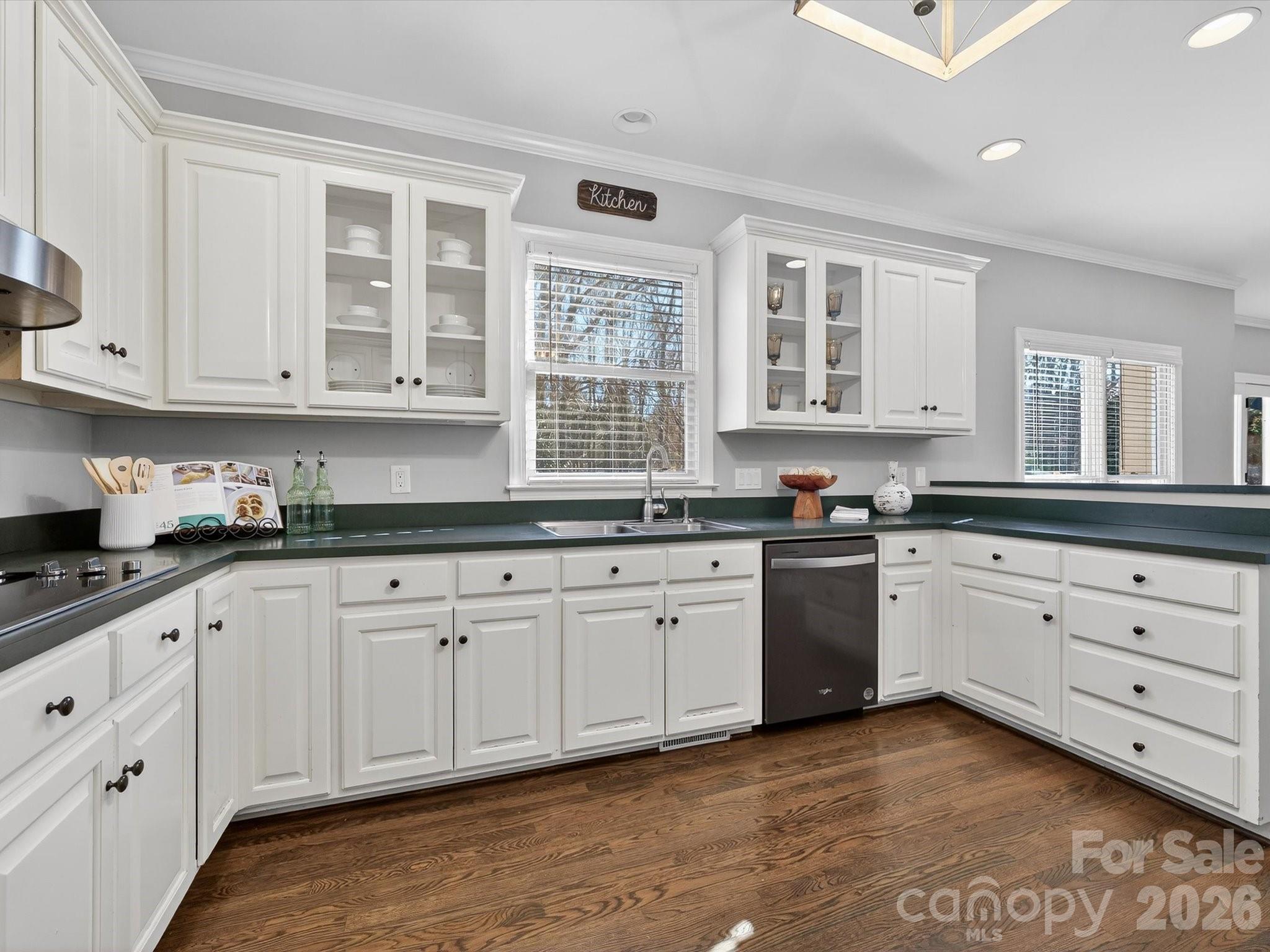 13446 Scanlan Way Davidson, NC 28036 - Photo 21 of 47 a kitchen with granite countertop white cabinets stainless steel appliances a sink and a window