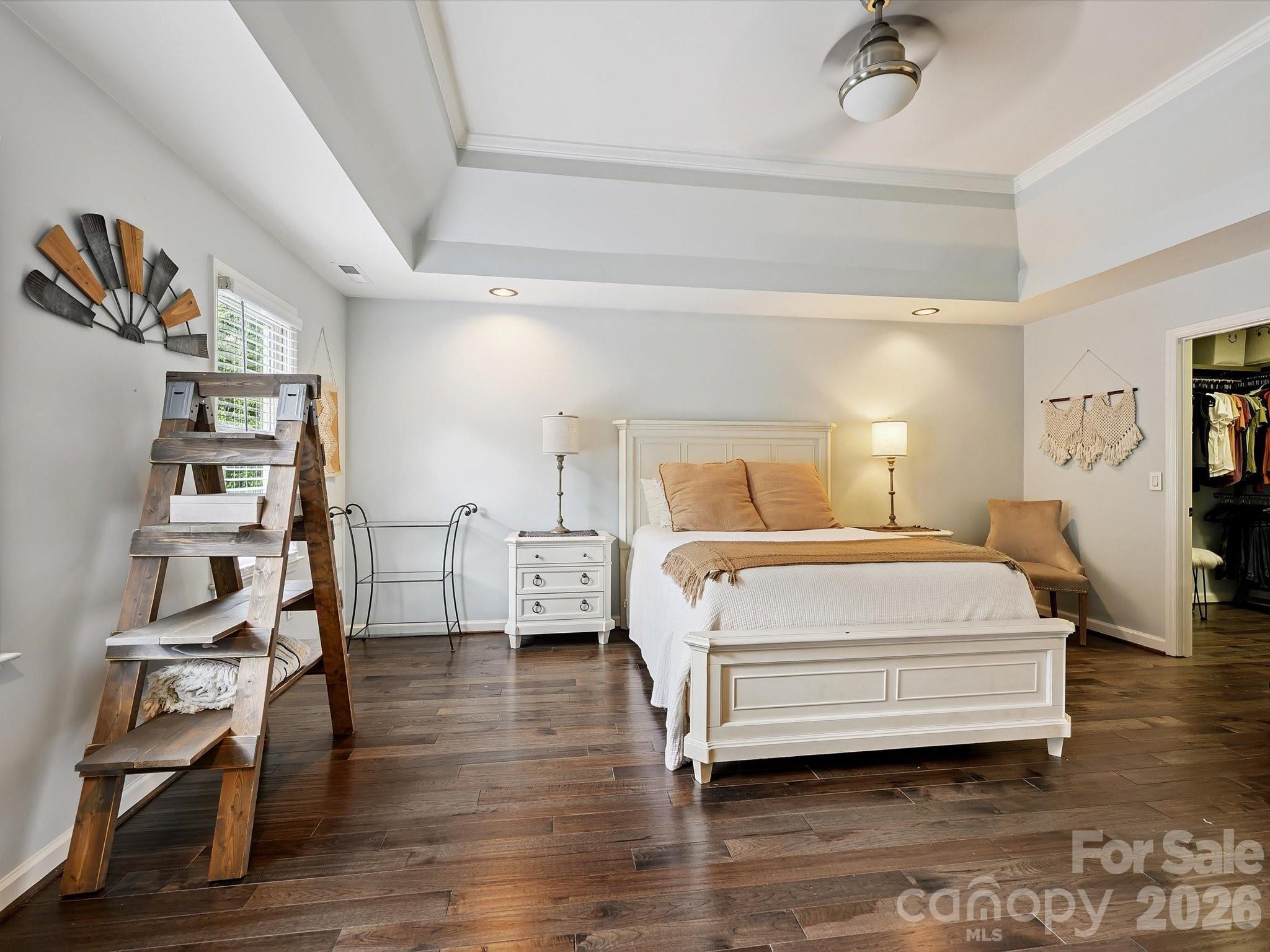 13446 Scanlan Way Davidson, NC 28036 - Photo 26 of 47 a bedroom with a bed and wooden floor