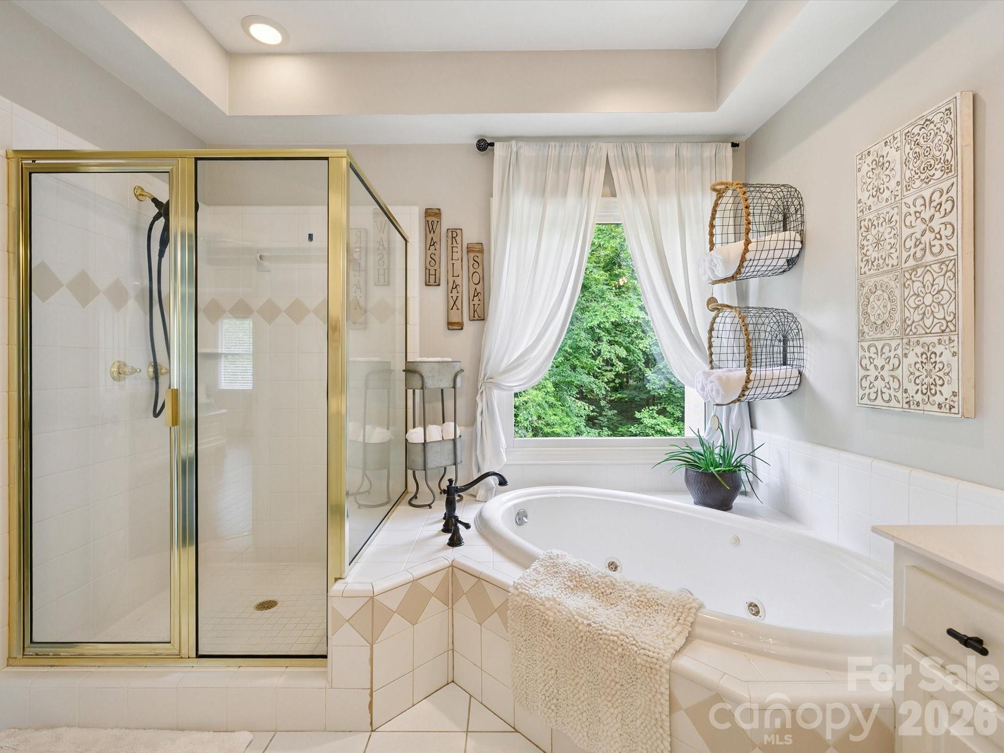 13446 Scanlan Way Davidson, NC 28036 - Photo 30 of 47 a bathroom with a tub shower and sink