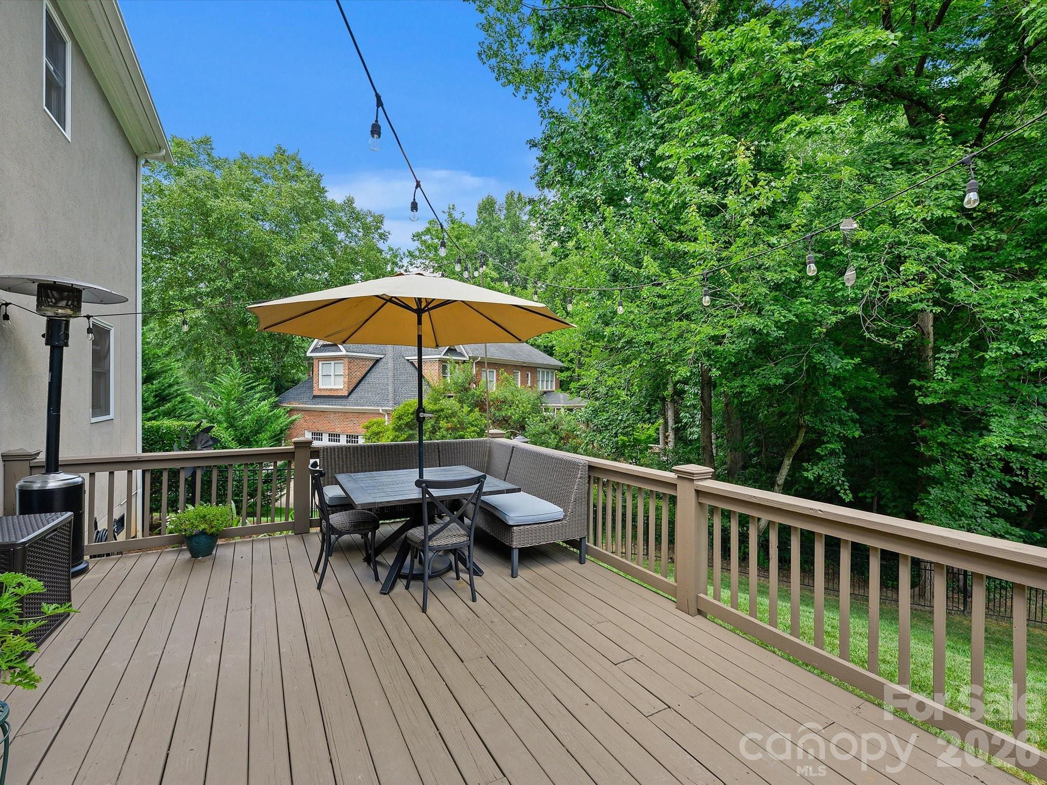 13446 Scanlan Way Davidson, NC 28036 - Photo 36 of 47 a view of balcony with outdoor seating and wooden floor