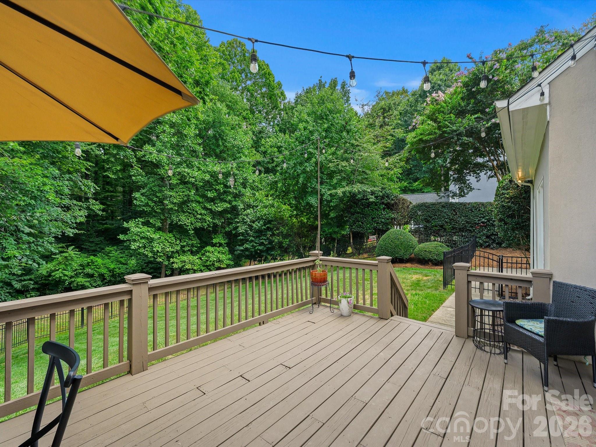 13446 Scanlan Way Davidson, NC 28036 - Photo 37 of 47 a view of balcony with deck and wooden floor