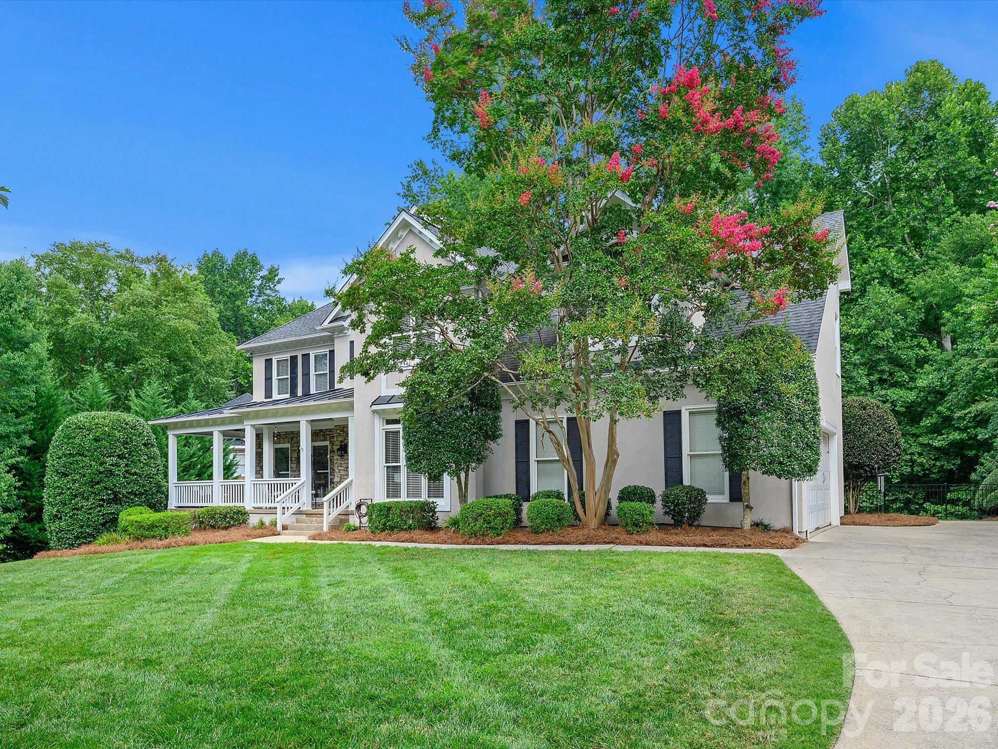 13446 Scanlan Way Davidson, NC 28036 - Photo 38 of 47 a front view of a house with garden