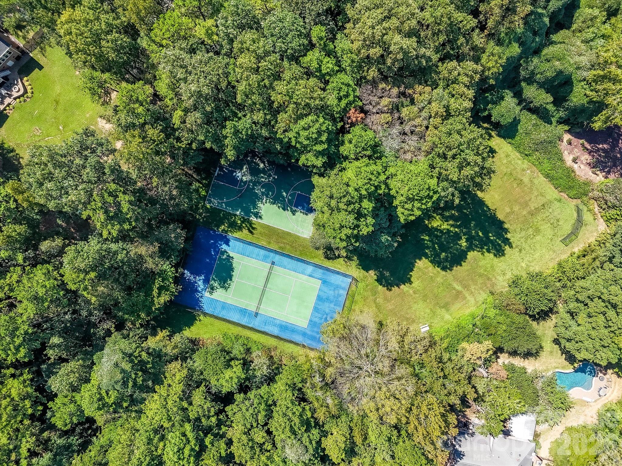 13446 Scanlan Way Davidson, NC 28036 - Photo 42 of 47 a view of a house with a yard and garden