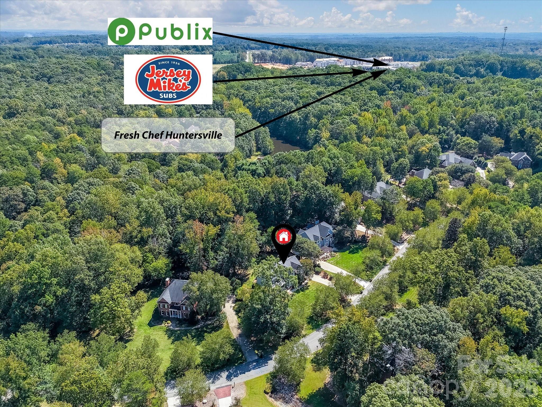 13446 Scanlan Way Davidson, NC 28036 - Photo 46 of 47 a sign broad in the middle of a forest