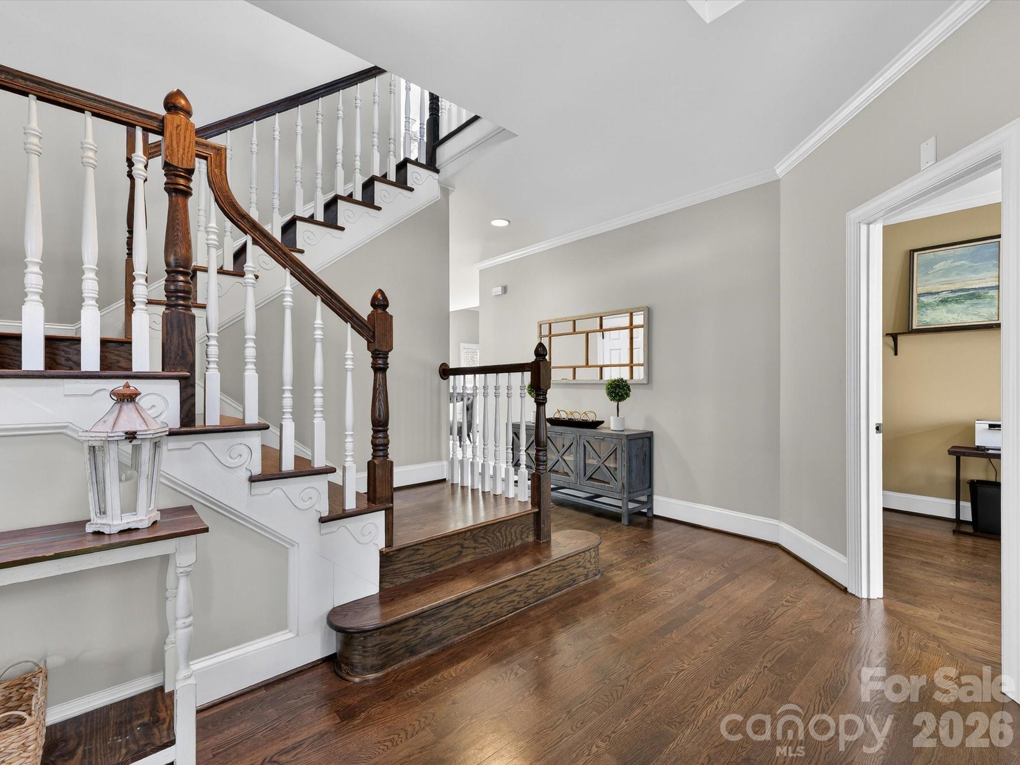 13446 Scanlan Way Davidson, NC 28036 - Photo 9 of 47 a view of staircase with living room and wooden floor