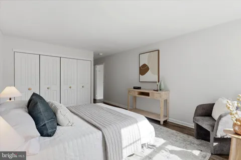 a bedroom with a bed and a desk
