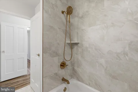 a bathroom with a glass shower door