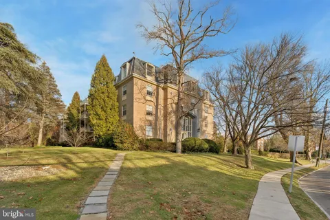 a view of a building with trees