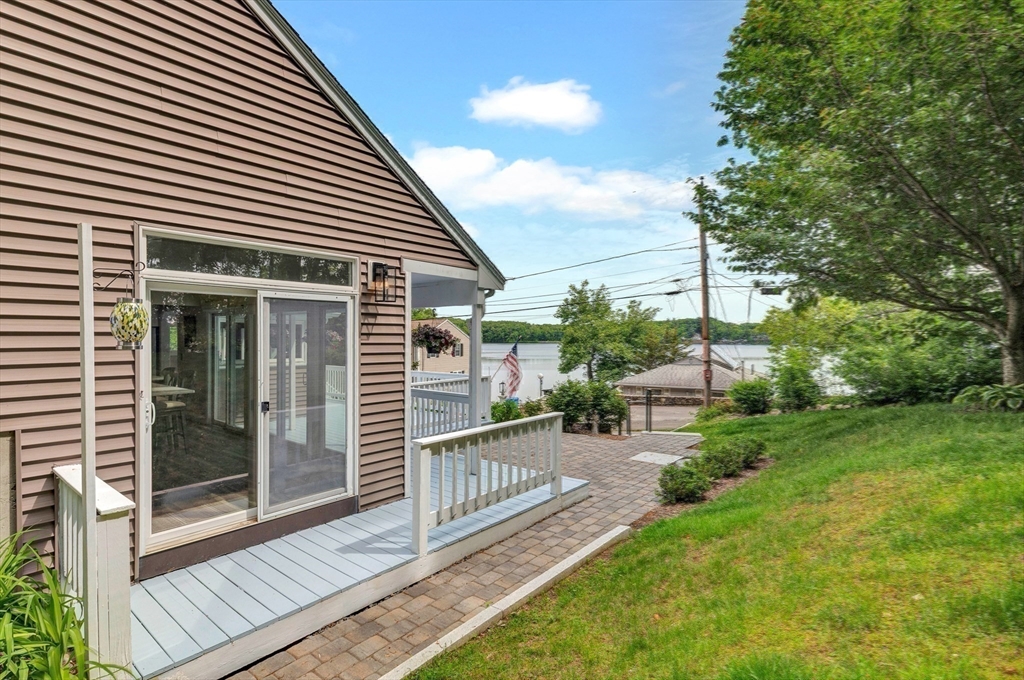 118 Woolford Road Wrentham, MA 02093 - Photo 34 of 41 a view of a house with a yard and floor to ceiling window
