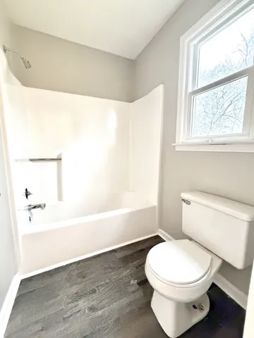 a view of empty room with ceiling fan
