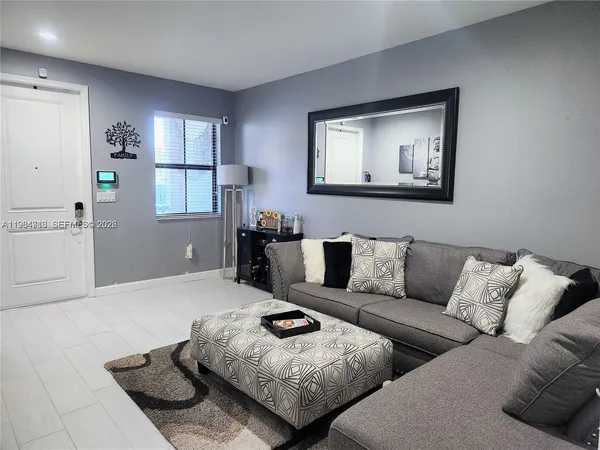 a living room with furniture and window