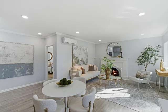 a living room with furniture kitchen and a table