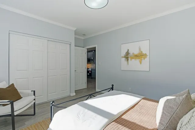 a bedroom with a bed and furniture