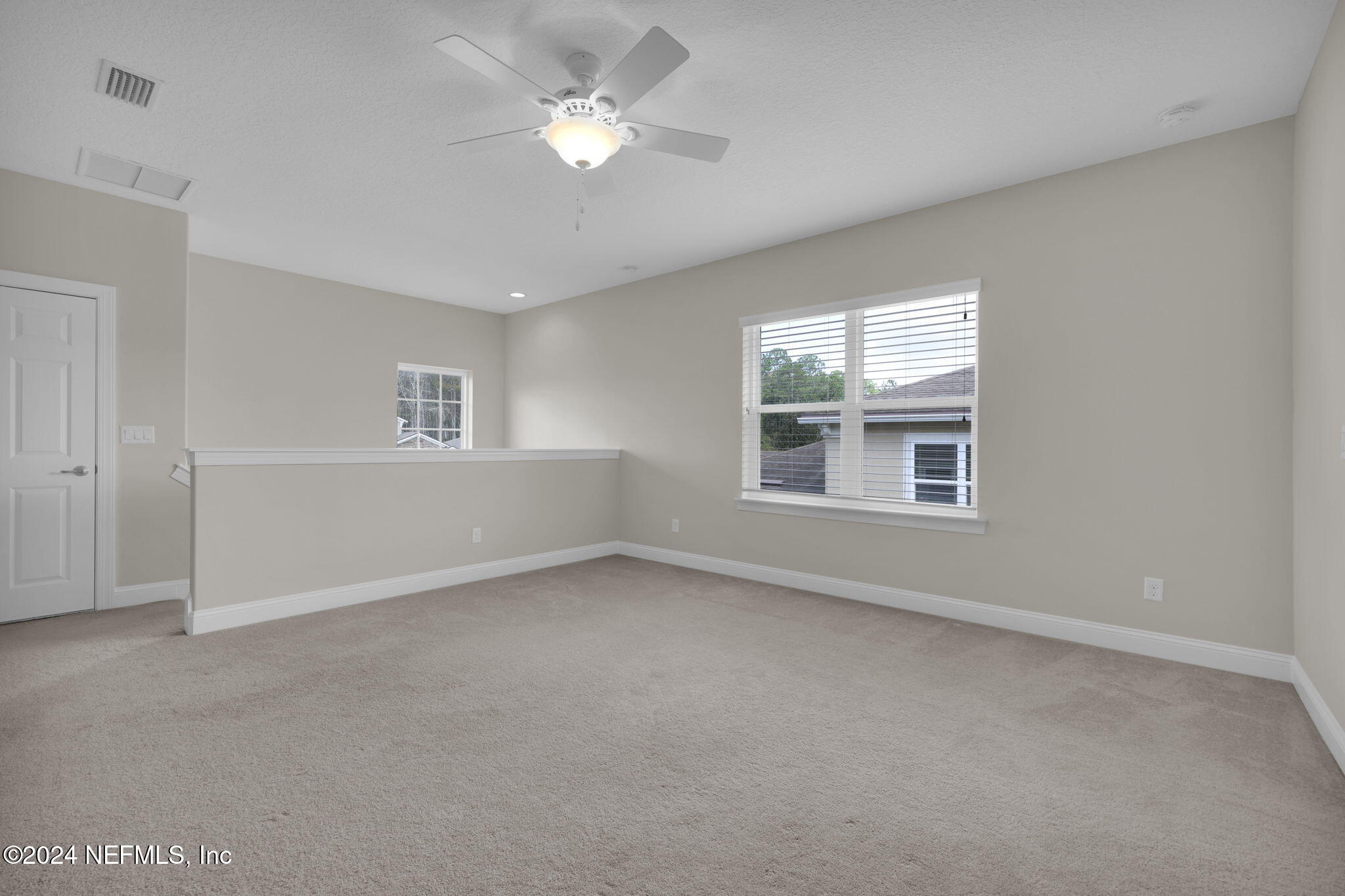 269 Gulfstream Way Ponte Vedra, FL 32081 - Photo 38 of 82 an empty room with a window and a ceiling fan