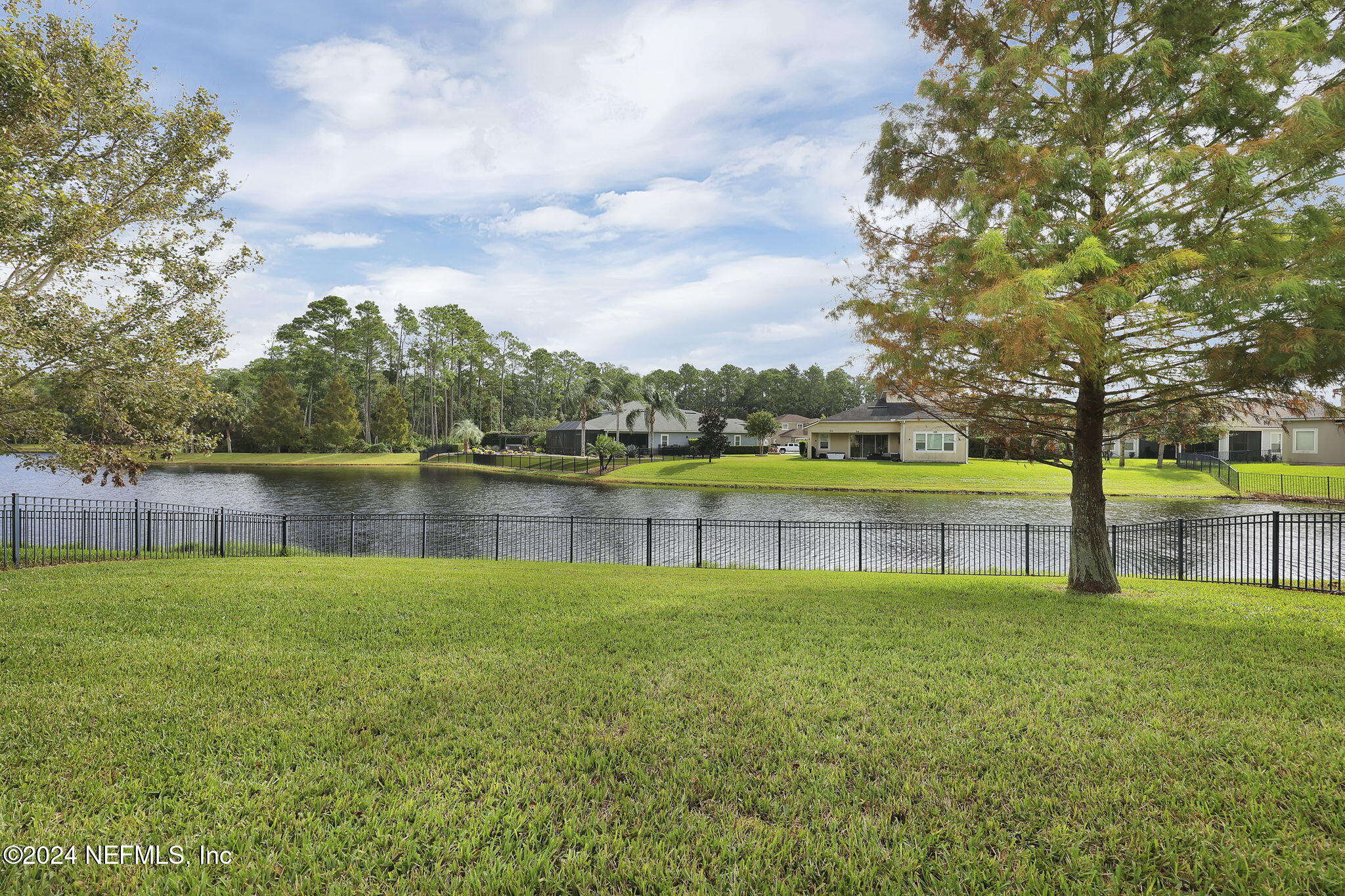 269 Gulfstream Way Ponte Vedra, FL 32081 - Photo 53 of 82 a view of a lake with a big yard and large trees