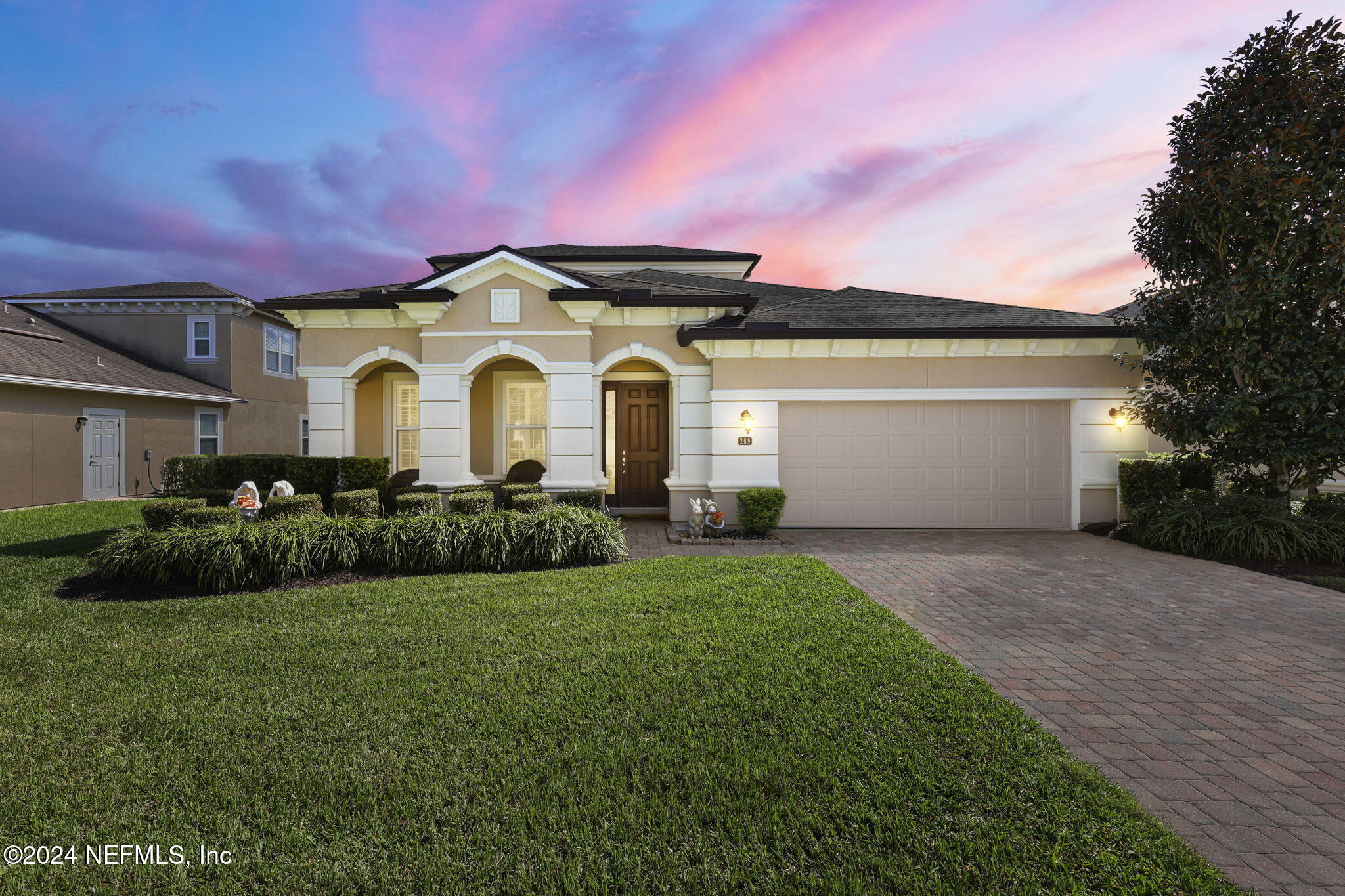 269 Gulfstream Way Ponte Vedra, FL 32081 - Photo 57 of 82 a front view of a house with a garden and plants