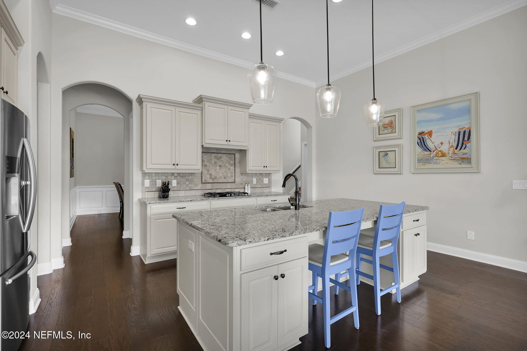 269 Gulfstream Way Ponte Vedra, FL 32081 - Photo 7 of 82 a kitchen with a table chairs refrigerator and microwave