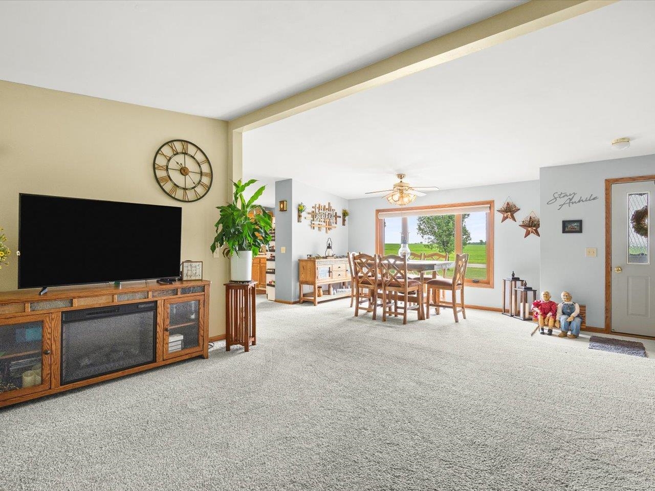 8500 Manchester Road Capron, IL 61012 - Photo 16 of 51 a living room with furniture and a flat screen tv
