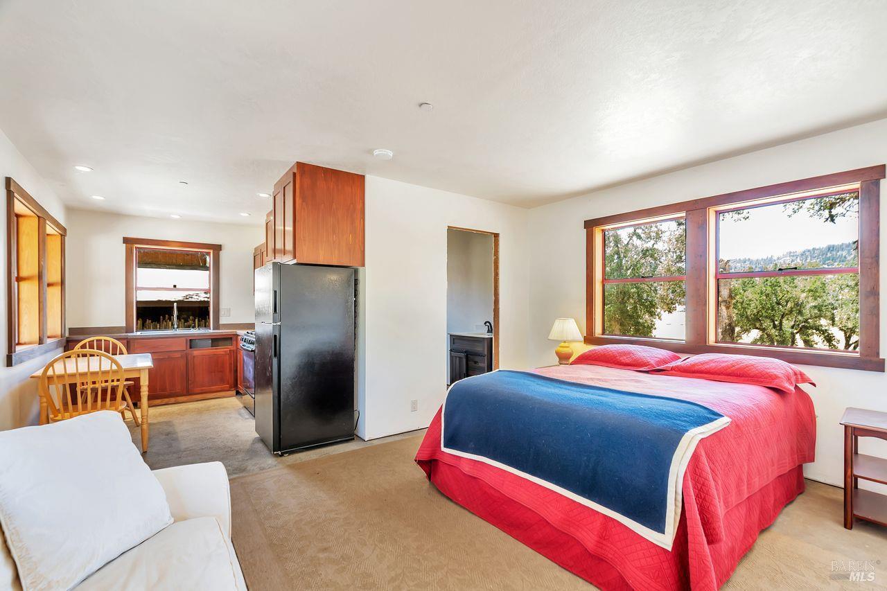17277 Butts Canyon Road Middletown, CA 95461 - Photo 8 of 41 a bedroom with a bed and a couch