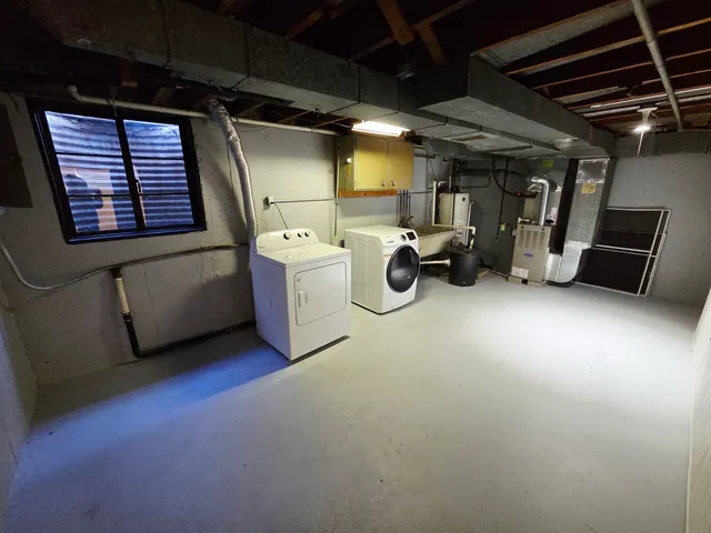 a view of a house with backyard and a garden