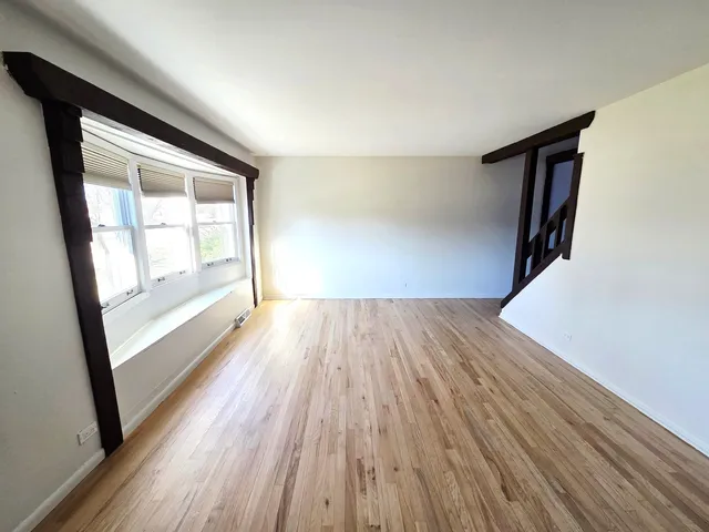 a large kitchen with kitchen island granite countertop a large counter top and stainless steel appliances