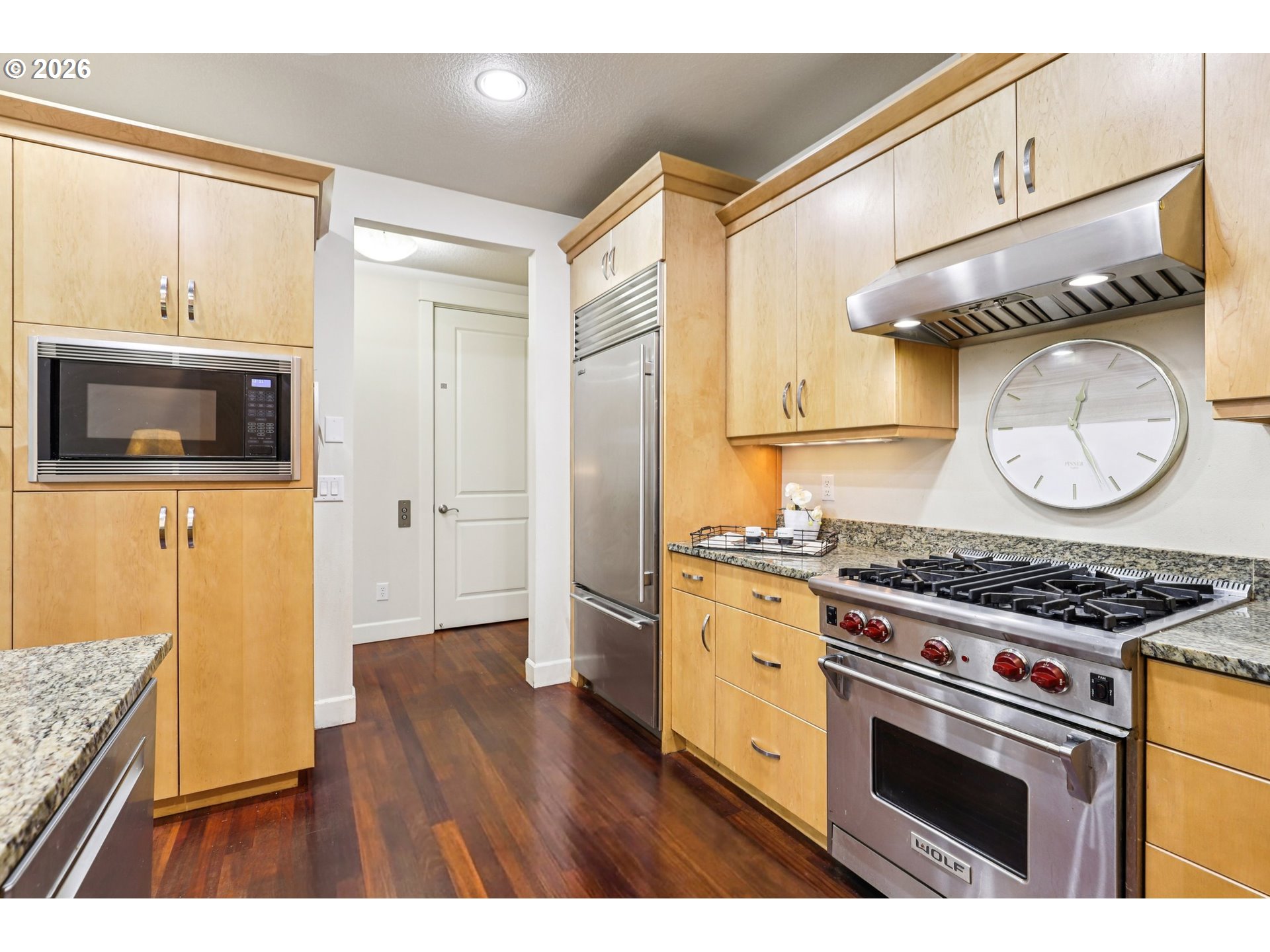 7812 Northwest Quinault Street Camas, WA 98607 - Photo 13 of 48 a kitchen with stainless steel appliances granite countertop a stove a sink and a microwave