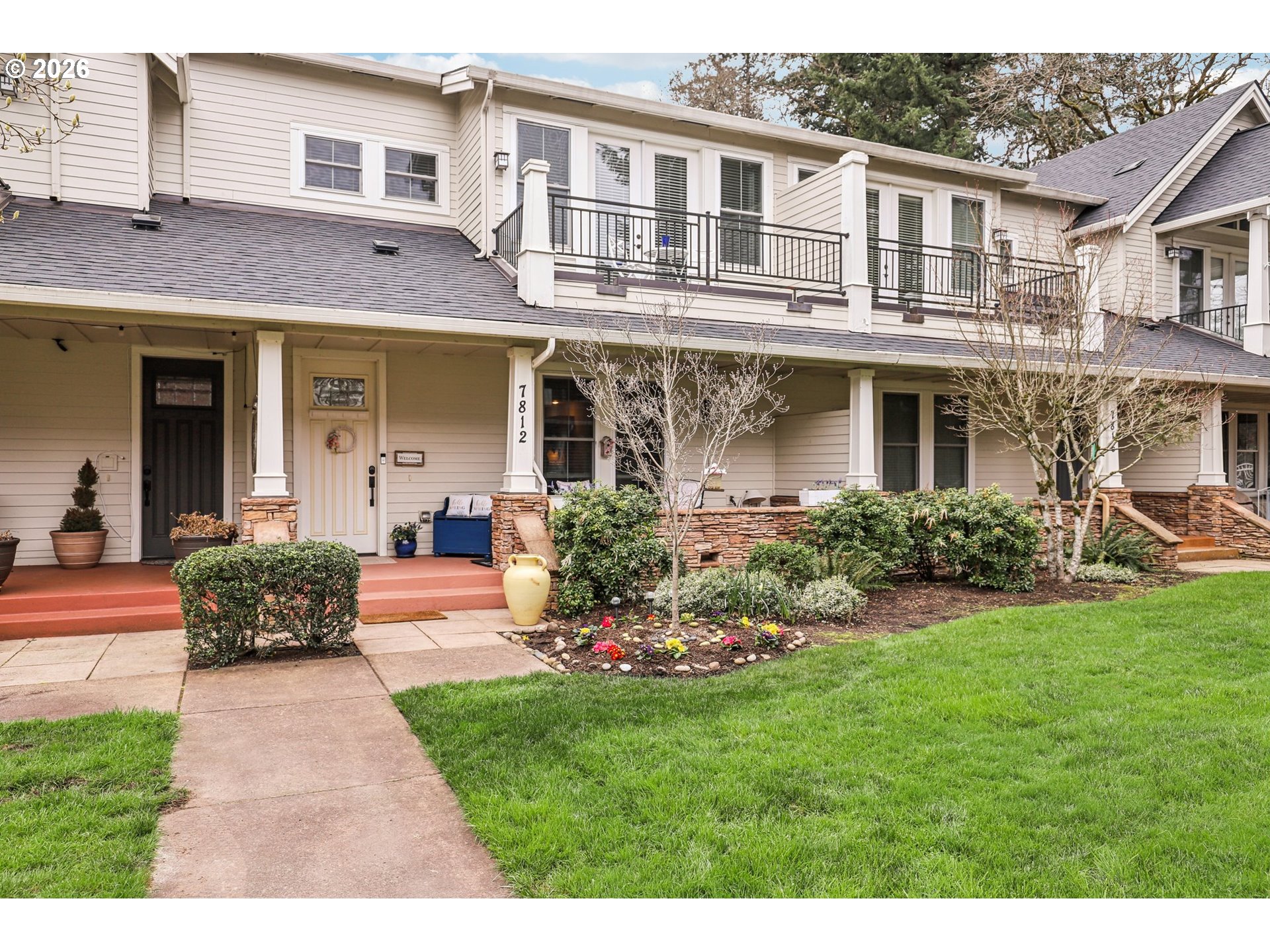 7812 Northwest Quinault Street Camas, WA 98607 - Photo 2 of 48 a front view of a house with a yard and potted plants