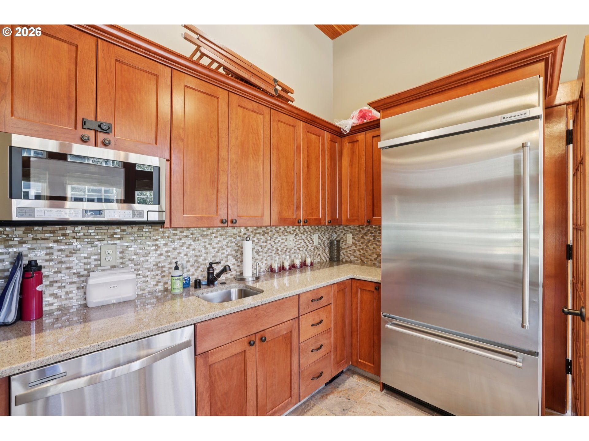 7812 Northwest Quinault Street Camas, WA 98607 - Photo 44 of 48 a kitchen with stainless steel appliances kitchen island granite countertop a refrigerator and cabinets