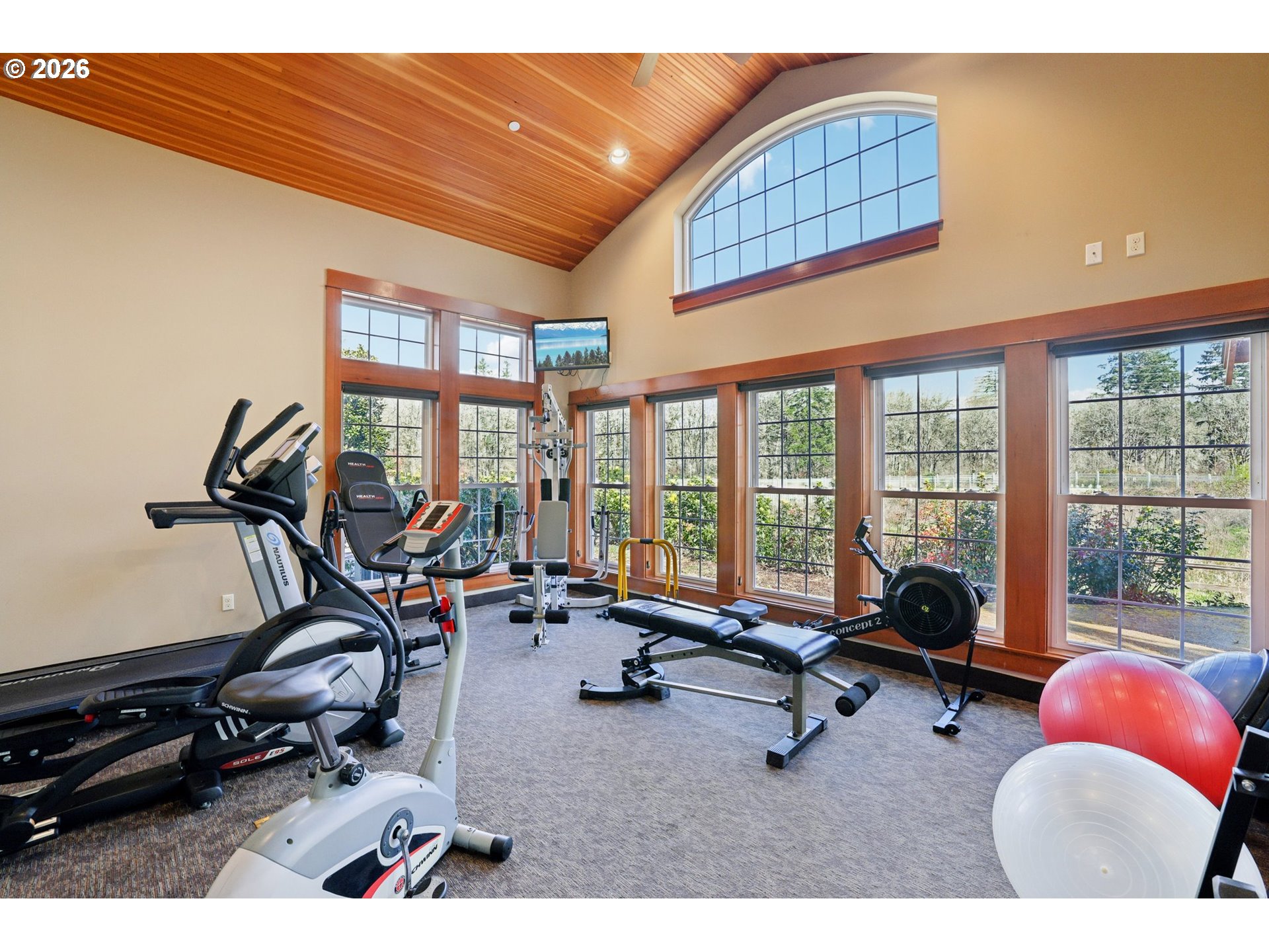 7812 Northwest Quinault Street Camas, WA 98607 - Photo 45 of 48 a room with gym equipment and floor to ceiling window