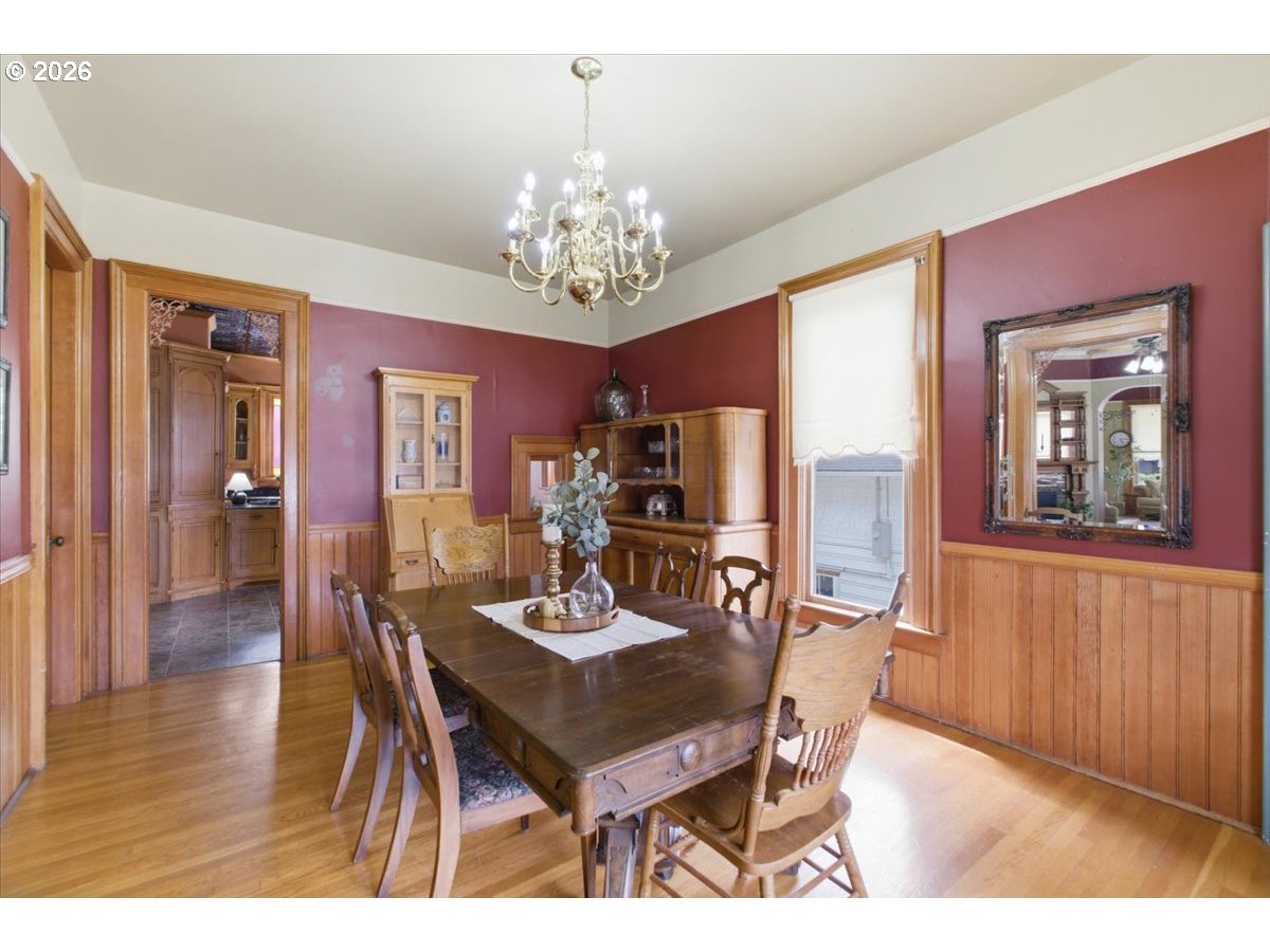 1121 Main Street Dallas, OR 97338 - Photo 14 of 48 a view of a dining room with furniture a chandelier and wooden floor