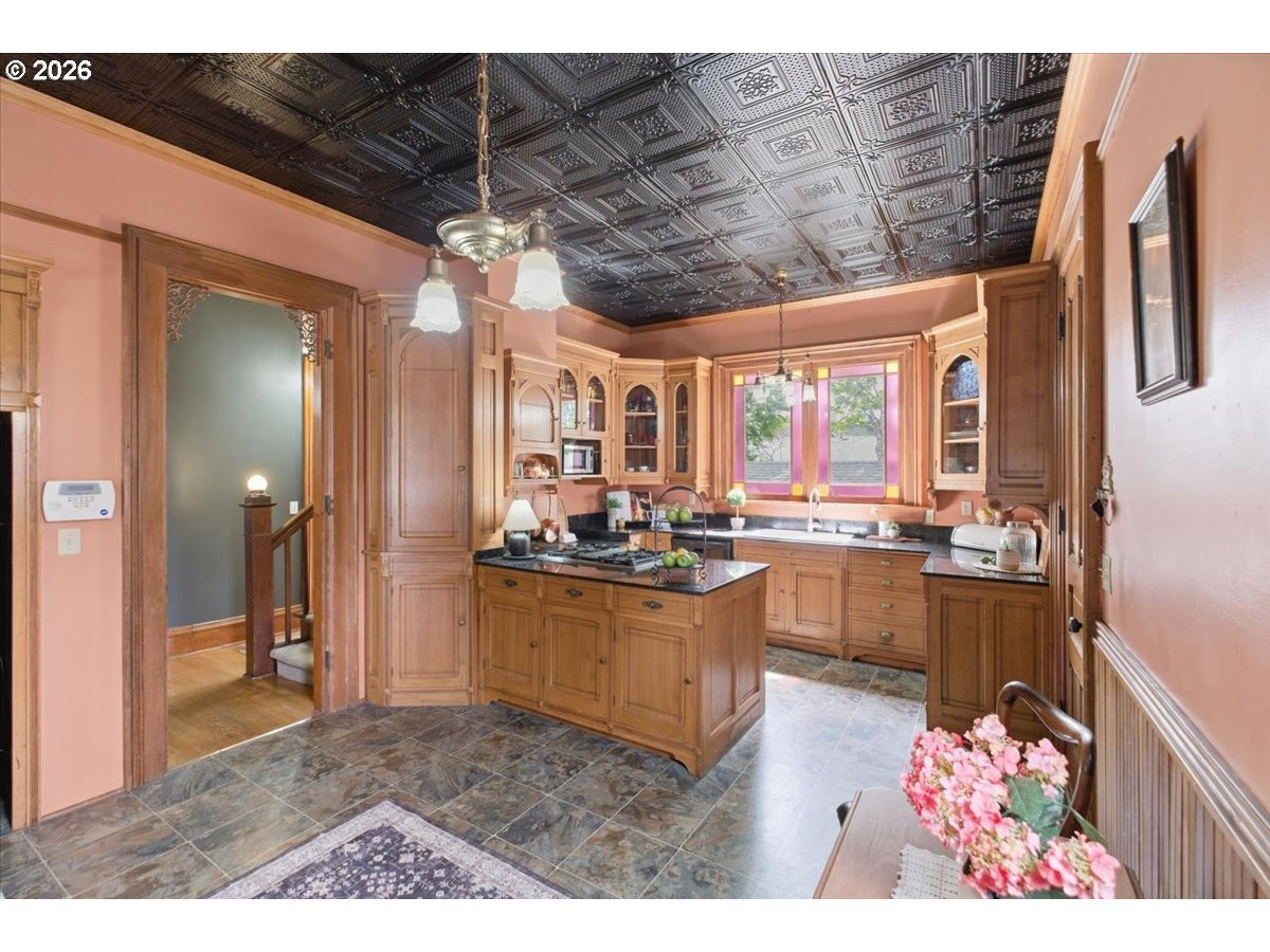 1121 Main Street Dallas, OR 97338 - Photo 16 of 48 a kitchen with stove and cabinets