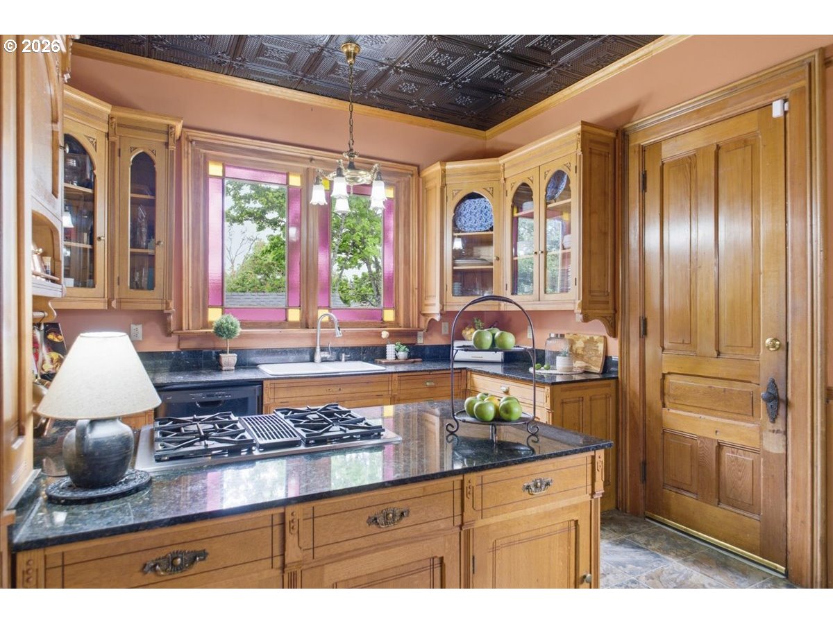 1121 Main Street Dallas, OR 97338 - Photo 19 of 48 a kitchen with stainless steel appliances granite countertop a stove a refrigerator and a microwave
