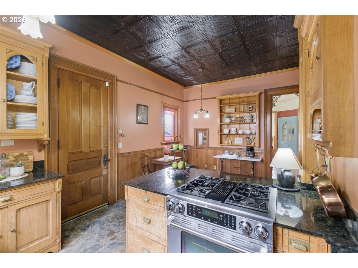1121 Main Street Dallas, OR 97338 - Photo 21 of 48 a kitchen with a stove a sink dishwasher and a refrigerator