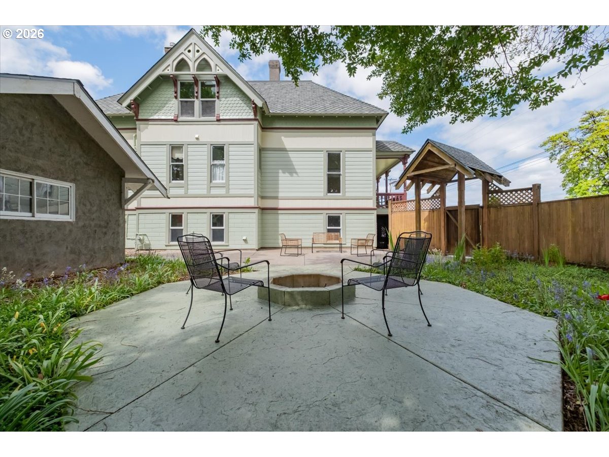 1121 Main Street Dallas, OR 97338 - Photo 45 of 48 a view of a house with backyard and a sitting area