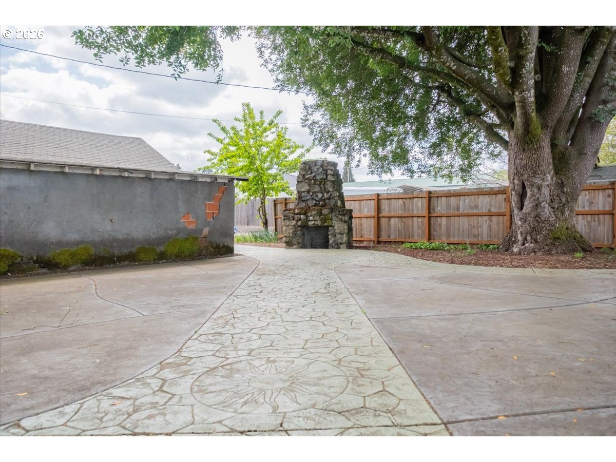 1121 Main Street Dallas, OR 97338 - Photo 46 of 48 a view of a backyard of a house