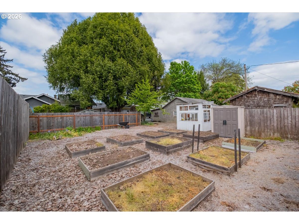 1121 Main Street Dallas, OR 97338 - Photo 47 of 48 a view of a backyard with a table and chairs