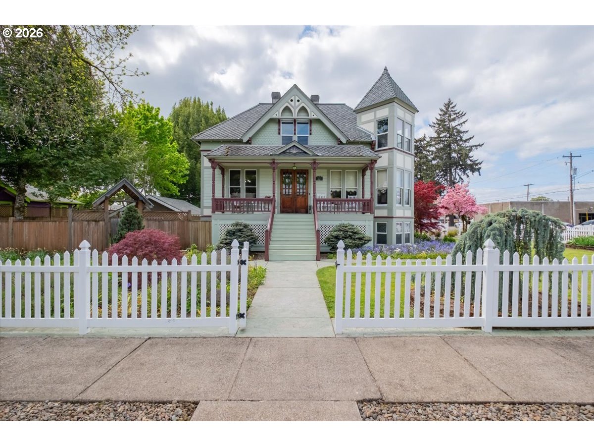 1121 Main Street Dallas, OR 97338 - Photo 6 of 48 a view of house with a garden and pathway