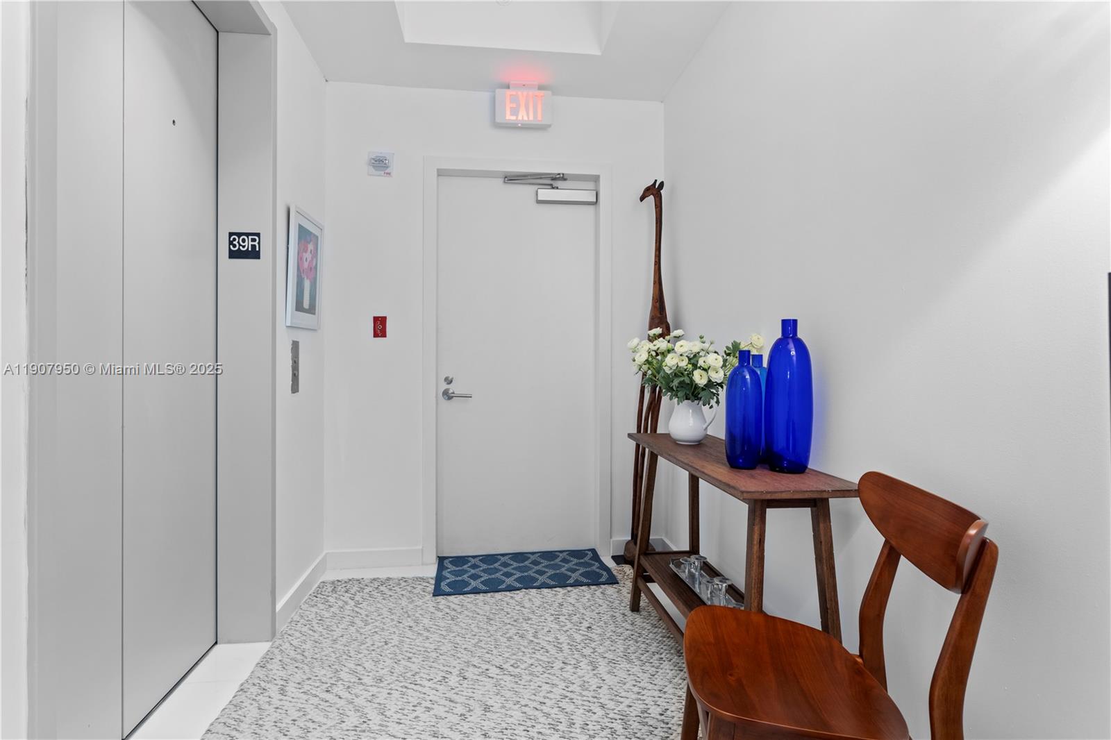 851 Northeast 1st Avenue, Unit 3907 Miami, FL 33132 - Photo 13 of 20 a view of a workspace with furniture and closet