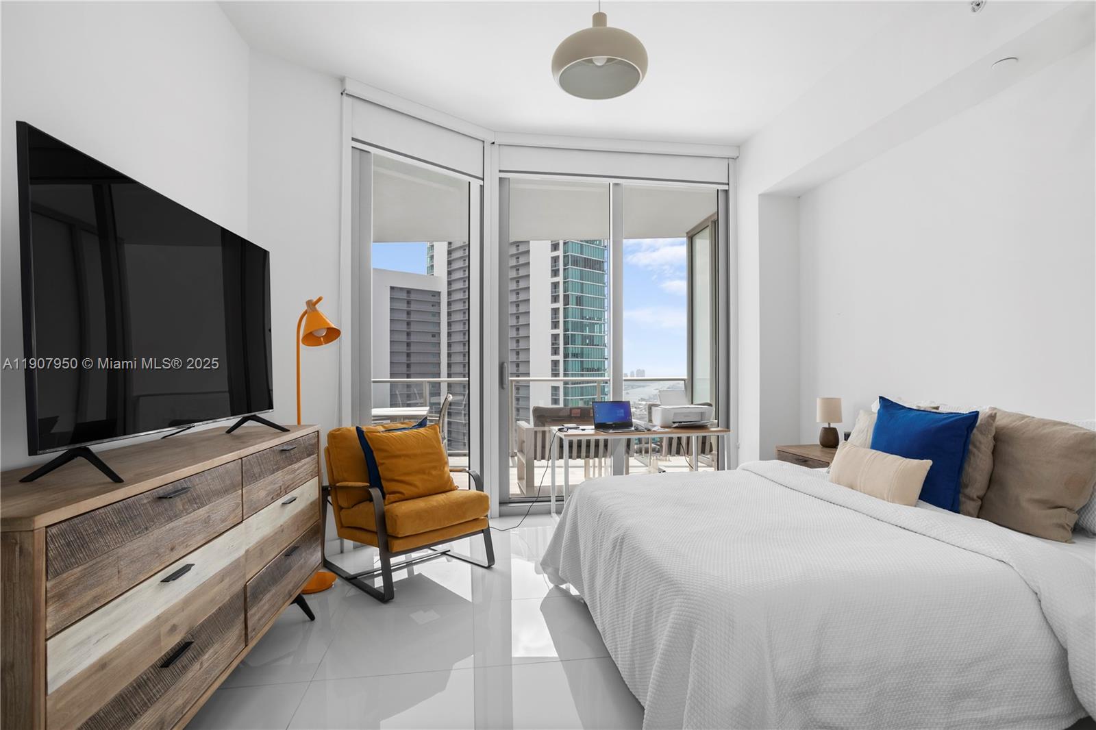 851 Northeast 1st Avenue, Unit 3907 Miami, FL 33132 - Photo 17 of 20 a bedroom with a bed and large window