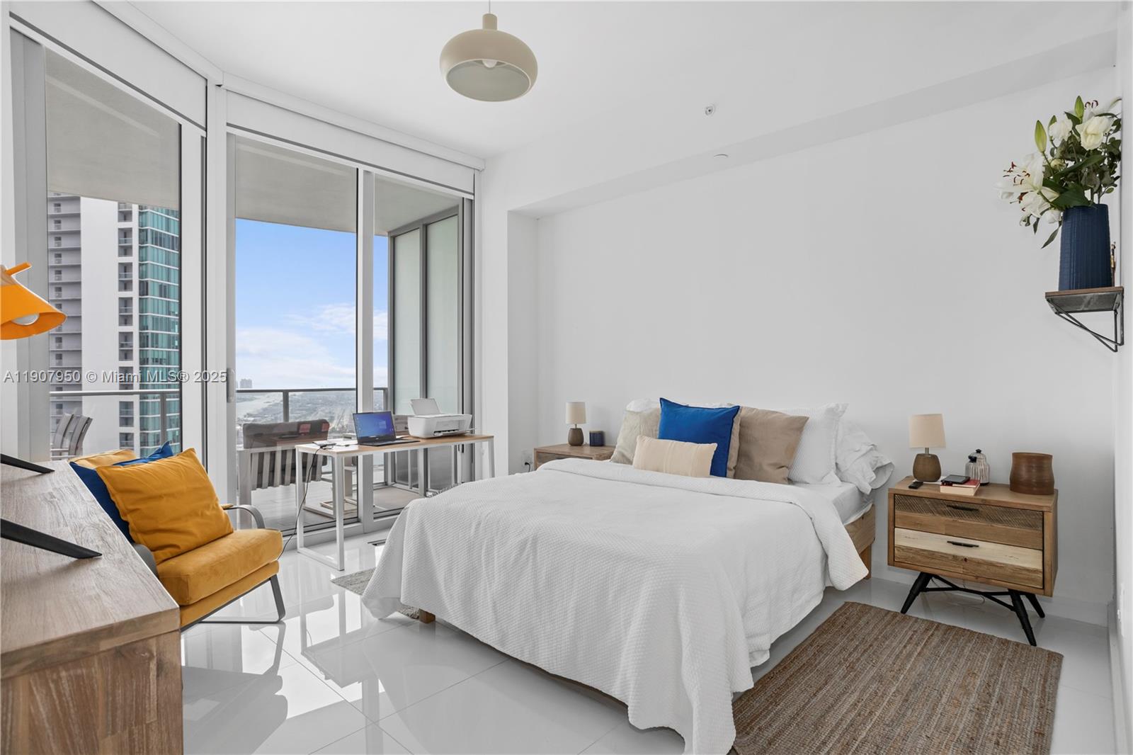 851 Northeast 1st Avenue, Unit 3907 Miami, FL 33132 - Photo 4 of 20 a bedroom with a bed and a couch