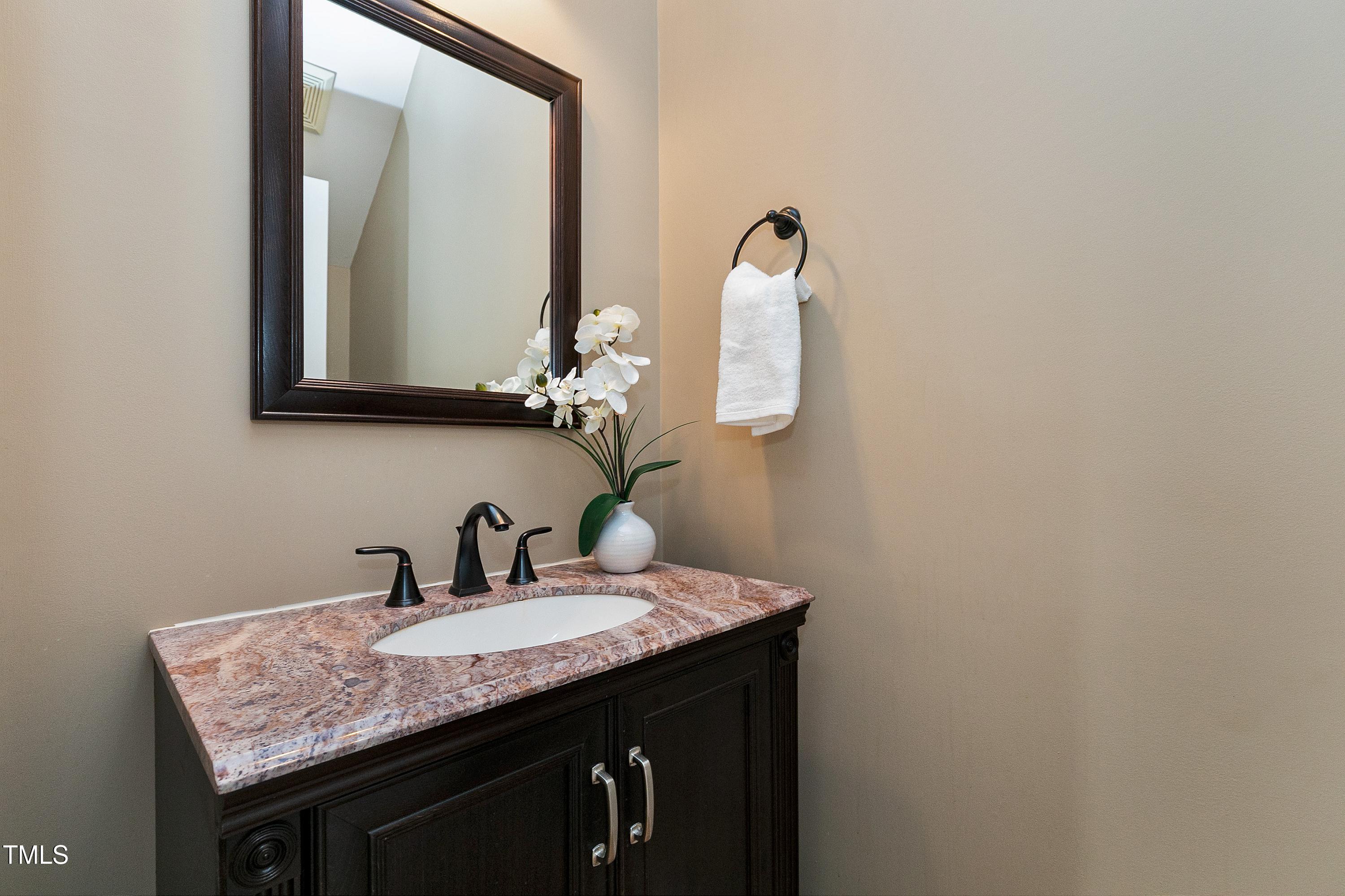 103 Sandy Hook Way Cary, NC 27513 - Photo 21 of 45 a bathroom with a granite countertop sink and a mirror